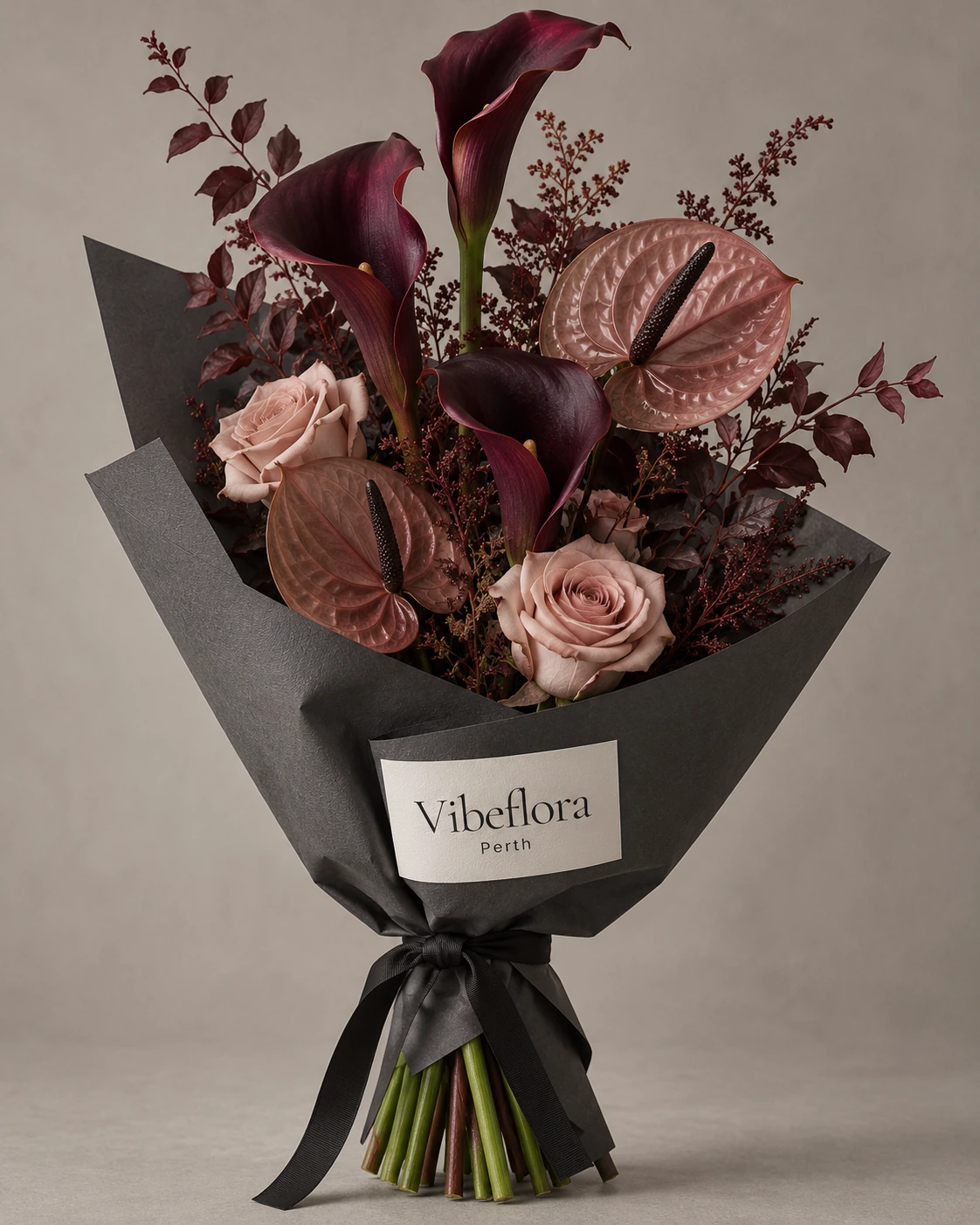 AI-generated Burgundy Line sculptural bouquet concept in charcoal wrapping with a physical Vibeflora Perth label